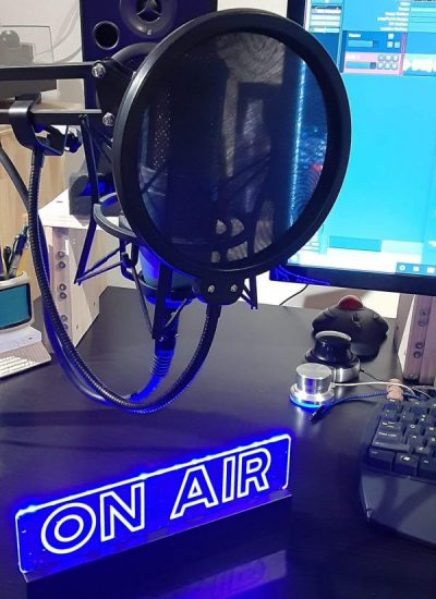 Picture of my microphone and a little ON AIR desktop sign I bought myself for my studio to give it some ambiance.